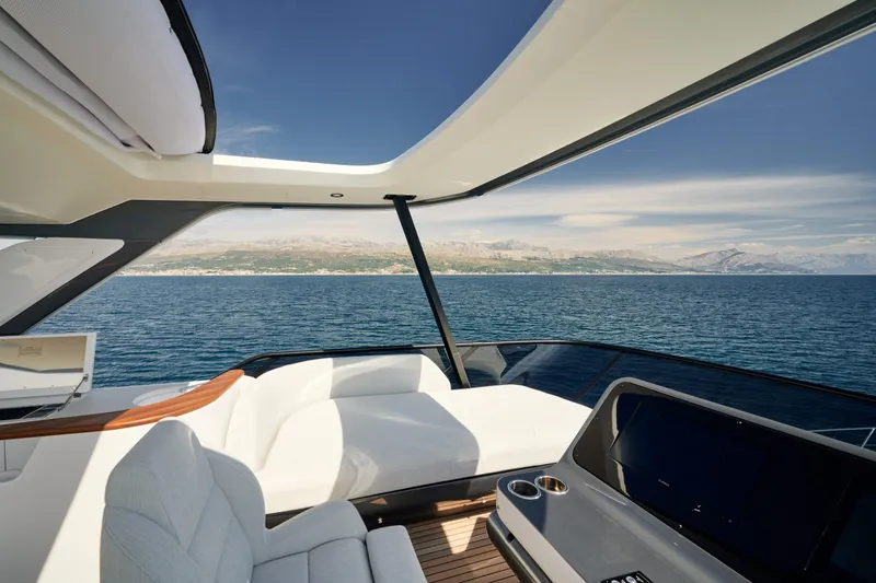  Yacht Photos Pics Luxurious 2022 Azimut 68 Hard Top yacht interior with ocean view and modern design.