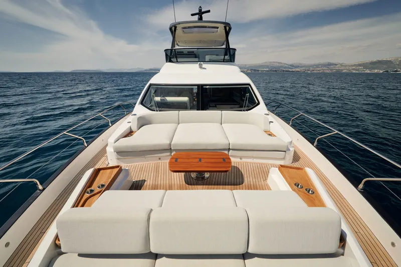 Yacht Photos Pics Luxurious 2022 Azimut 68 Hard Top yacht with spacious deck and elegant seating.