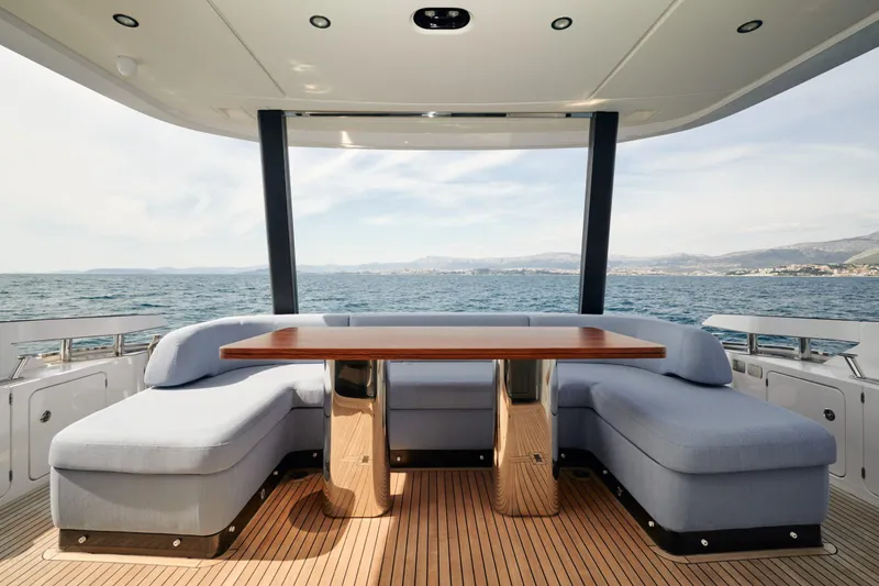  Yacht Photos Pics Luxurious 2022 Azimut 68 Hard Top yacht deck with elegant seating and ocean view.