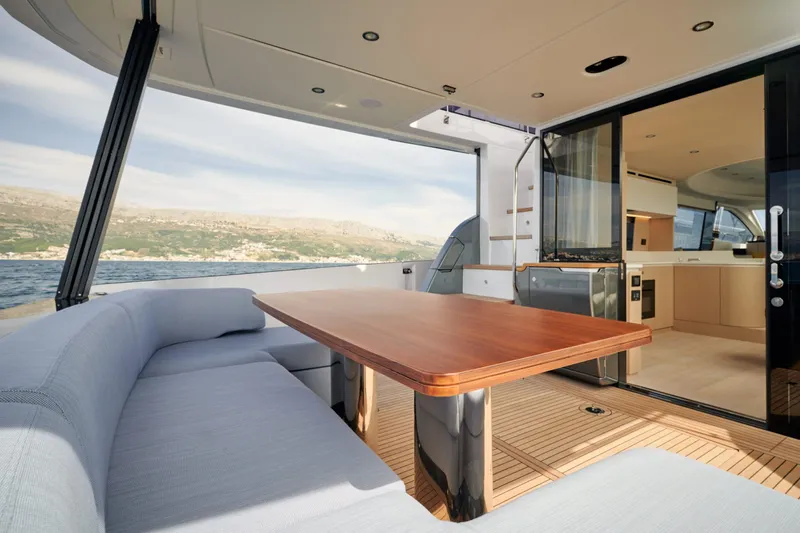  Yacht Photos Pics Luxurious 2022 Azimut 68 Hard Top yacht interior with elegant seating and ocean view.