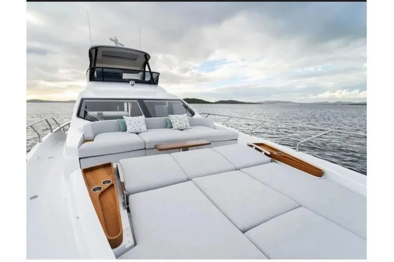  Yacht Photos Pics Luxurious 2022 Azimut 68 yacht with spacious deck and scenic ocean view.