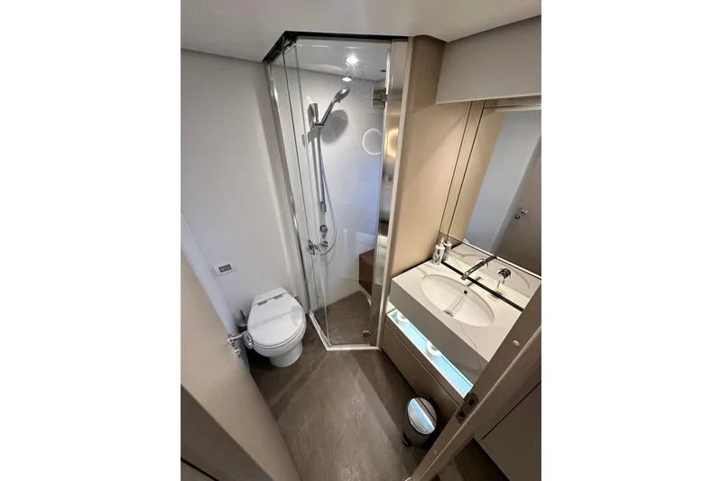  Yacht Photos Pics Luxurious bathroom in 2022 Azimut 68 yacht with modern shower and dual sink vanity.
