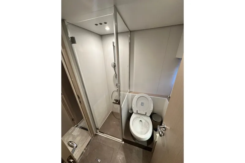  Yacht Photos Pics Bathroom interior of 2022 Azimut 68 yacht with shower and toilet.