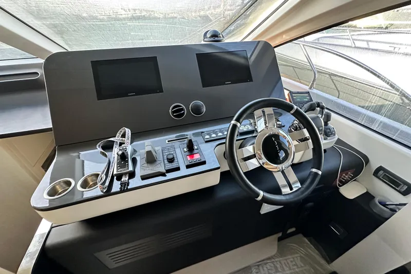  Yacht Photos Pics Cockpit of 2022 Azimut 68 yacht with modern steering and control panels.