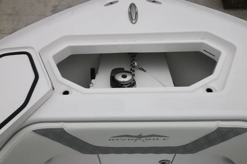  Yacht Photos Pics 2025 Invincible 33 Open Fisherman boat anchor compartment, showcasing sleek design and functionality.