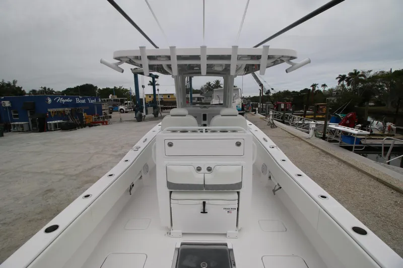  Yacht Photos Pics 2025 Invincible 33 Open Fisherman boat, spacious deck, modern design, docked at marina.