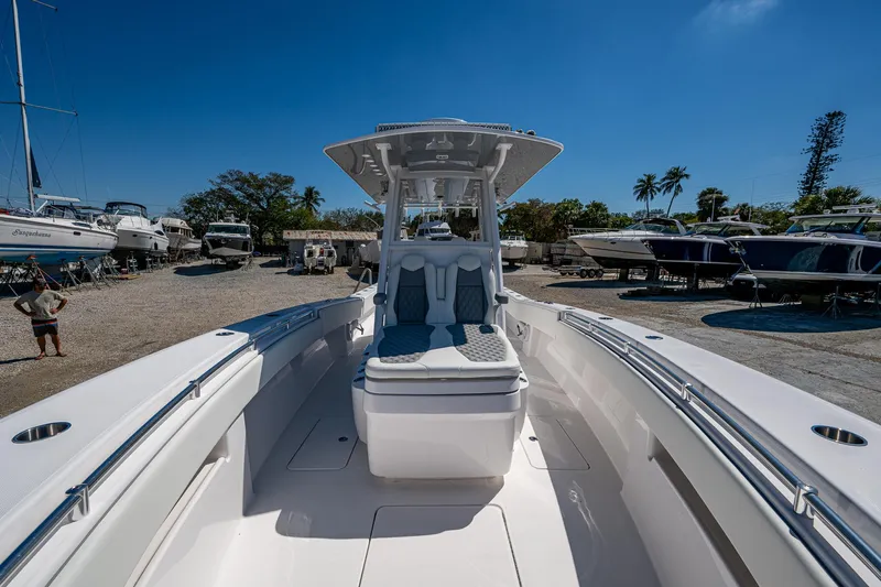  Yacht Photos Pics 2025 Invincible 33 Open Fisherman boat docked under clear blue sky.