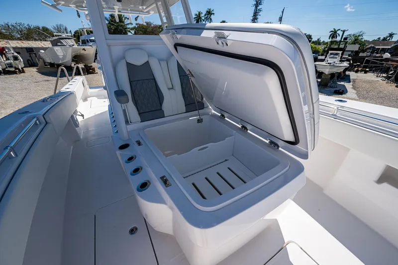  Yacht Photos Pics 2025 Invincible 33 Open Fisherman boat with open storage compartment and seating.