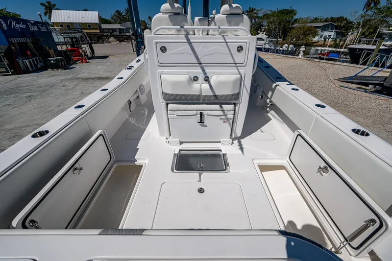  Yacht Photos Pics 2025 Invincible 33 Open Fisherman boat interior with storage compartments and seating.