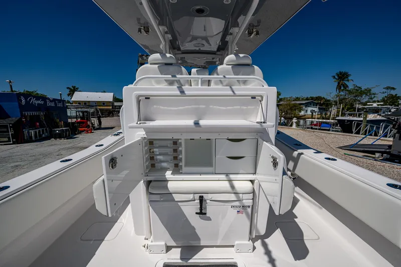  Yacht Photos Pics 2025 Invincible 33 Open Fisherman boat interior with storage compartments and seating.