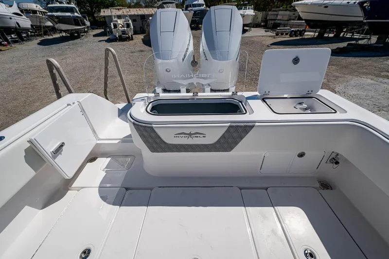  Yacht Photos Pics 2025 Invincible 33 Open Fisherman boat interior with dual engines and storage compartments.
