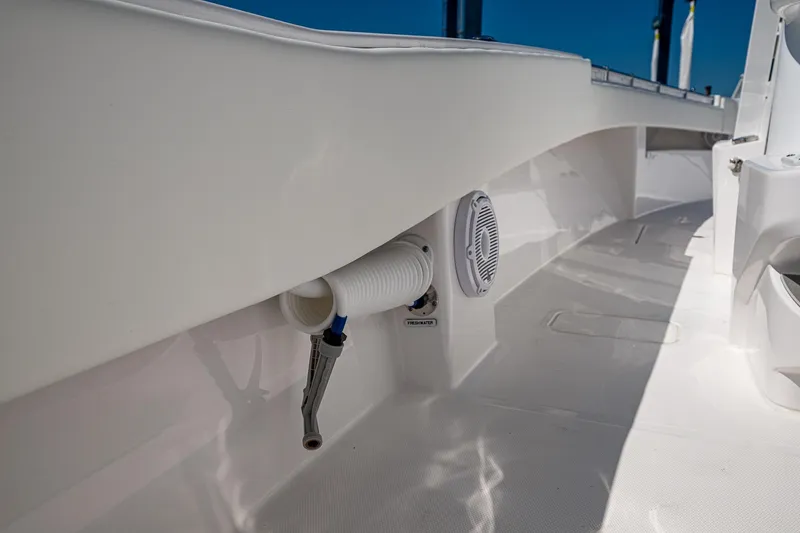  Yacht Photos Pics 2025 Invincible 33 Open Fisherman boat deck, featuring sleek design and built-in speaker.