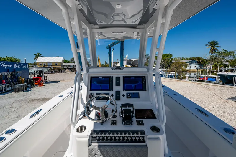 Yacht Photos Pics 2025 Invincible 33 Open Fisherman boat console with advanced navigation systems.