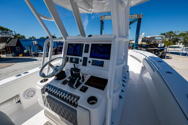  Yacht Photos Pics 2025 Invincible 33 Open Fisherman boat cockpit with advanced navigation controls.