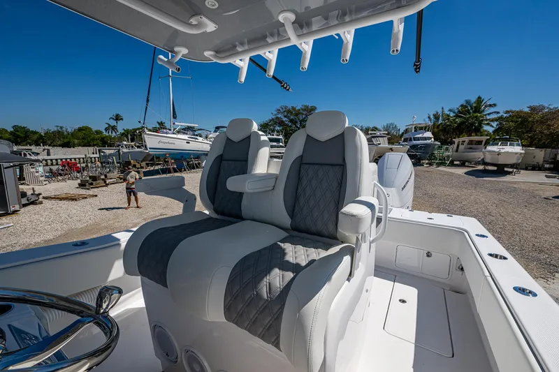  Yacht Photos Pics 2025 Invincible 33 Open Fisherman boat with luxurious seating and modern design.