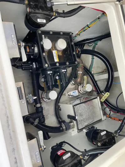  Yacht Photos Pics Engine compartment of a 2023 SeaVee 37 Z boat, showcasing mechanical components and wiring.
