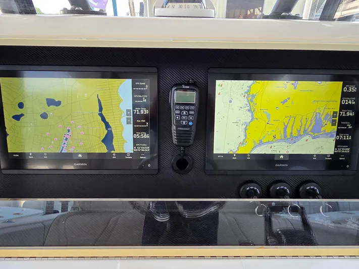  Yacht Photos Pics 2023 SeaVee 37 Z boat dashboard with dual Garmin navigation screens and communication device.