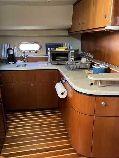  Yacht Photos Pics 2009 Tiara Yachts 4300 Sovran galley with wood cabinetry and modern appliances.