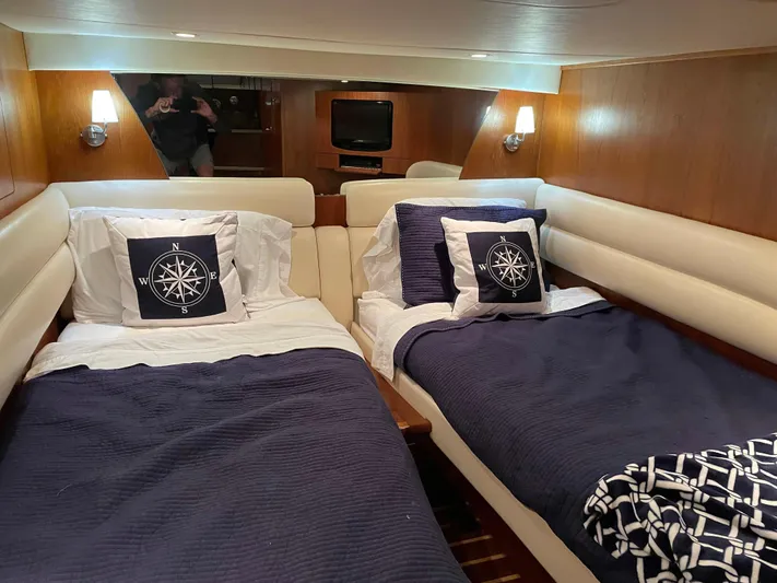  Yacht Photos Pics Interior of 2009 Tiara Yachts 4300 Sovran with twin beds and nautical-themed decor.