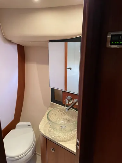  Yacht Photos Pics 2009 Tiara Yachts 4300 Sovran bathroom with modern sink and toilet.