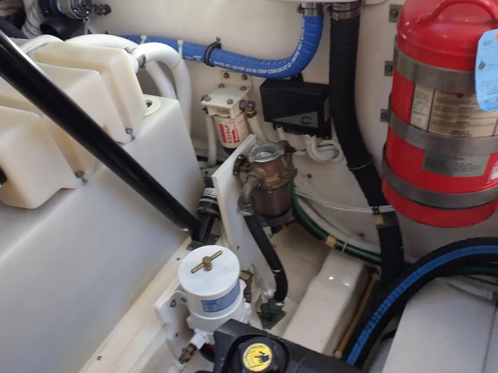  Yacht Photos Pics Engine compartment of 2009 Tiara Yachts 4300 Sovran with fire extinguisher and hoses.