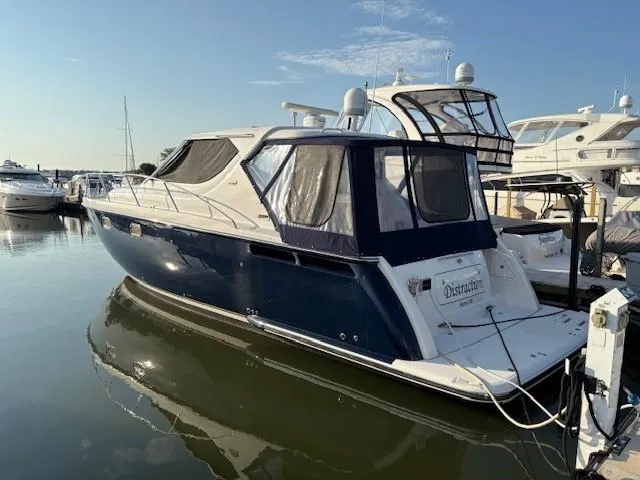  Yacht Photos Pics 2009 Tiara Yachts 4300 Sovran docked in a marina, side view.
