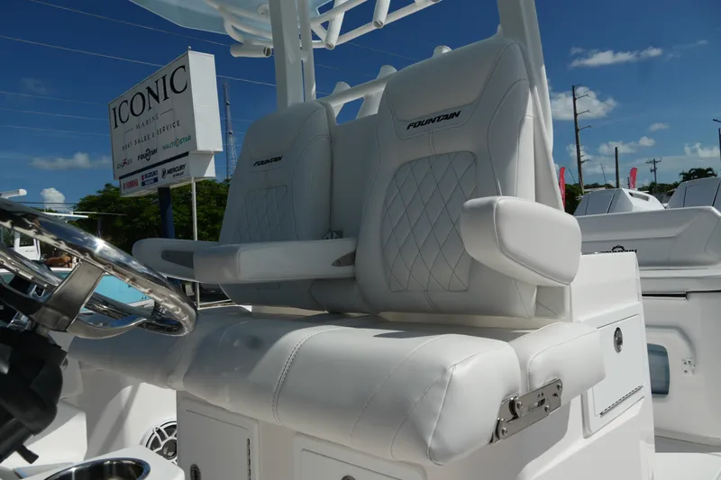 Yacht Photos Pics 2025 Fountain 32 NX boat with luxurious white seating and steering wheel, at Iconic Marine.