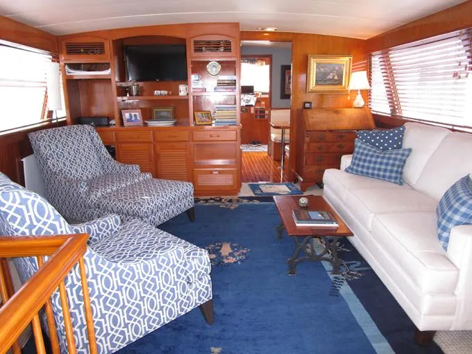 My Alibi Yacht Photos Pics Luxurious 1973 Matthews Voyager yacht interior with elegant seating, wooden cabinetry, and nautical decor.