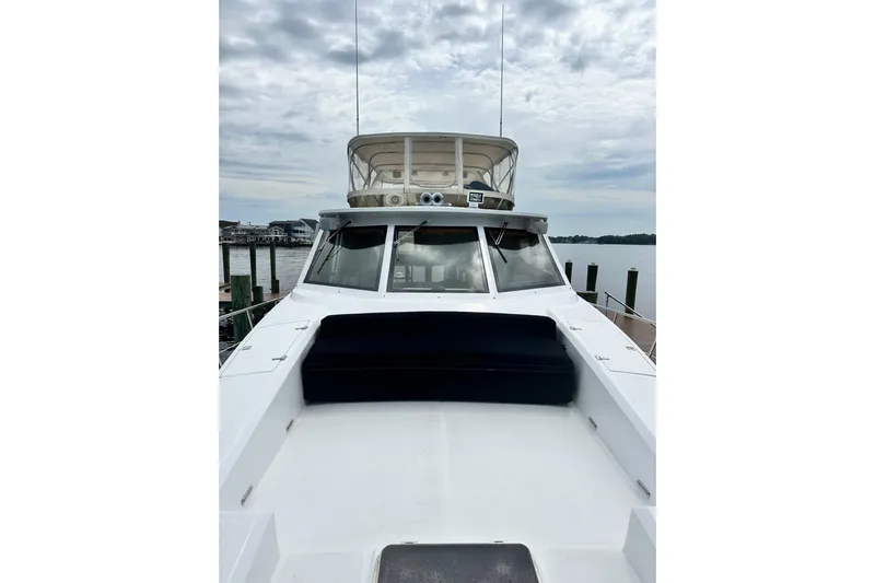  Yacht Photos Pics 2002 McKinna 57 Pilothouse yacht docked, showcasing sleek design and spacious deck.