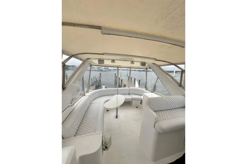  Yacht Photos Pics Luxurious interior of 2002 McKinna 57 Pilothouse yacht with panoramic water views.
