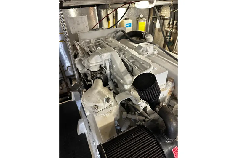  Yacht Photos Pics Engine room of 2002 McKinna 57 Pilothouse yacht, showcasing detailed machinery.