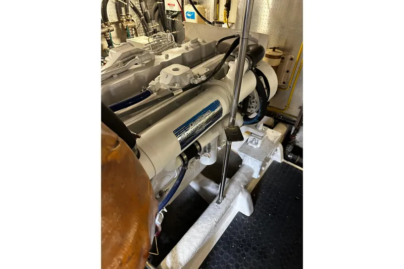  Yacht Photos Pics Engine room of 2002 McKinna 57 Pilothouse yacht, showcasing mechanical components.