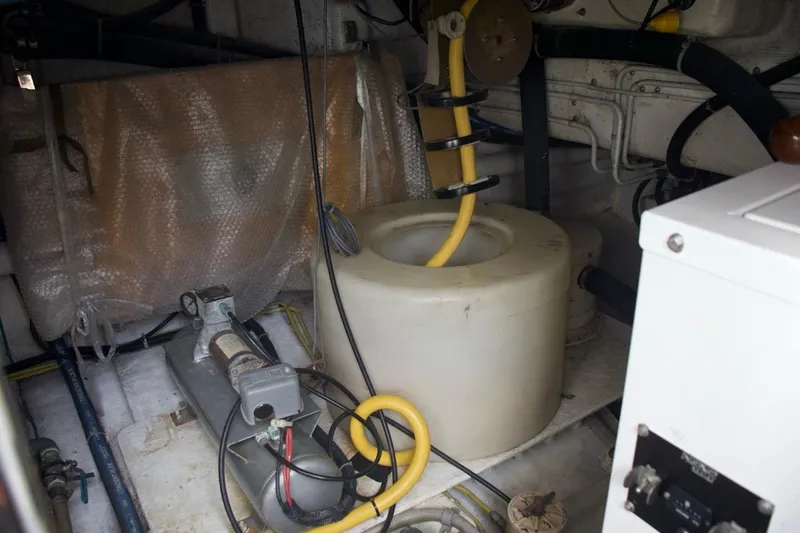  Yacht Photos Pics Engine room of 2002 McKinna 57 Pilothouse yacht with equipment and wiring.