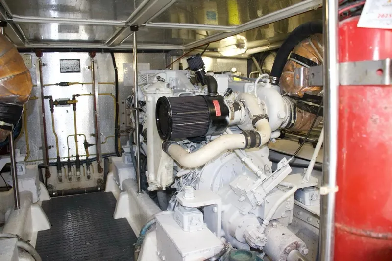  Yacht Photos Pics Engine room of a 2002 McKinna 57 Pilothouse yacht, showcasing machinery and components.