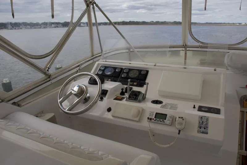  Yacht Photos Pics Pilothouse of 2002 McKinna 57 yacht with steering wheel and navigation controls.