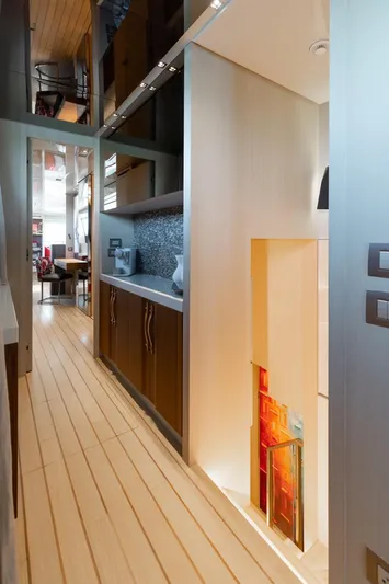 Fifty Shades Yacht Photos Pics Interior of 2018 Sanlorenzo SL106 yacht, featuring sleek wood flooring and modern cabinetry.