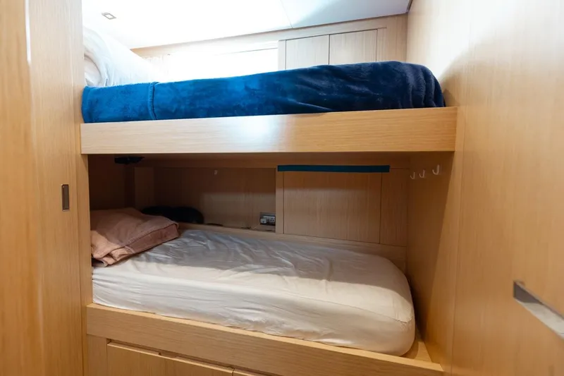 Fifty Shades Yacht Photos Pics Bunk beds in 2018 Sanlorenzo SL106 yacht cabin, featuring light wood interior.