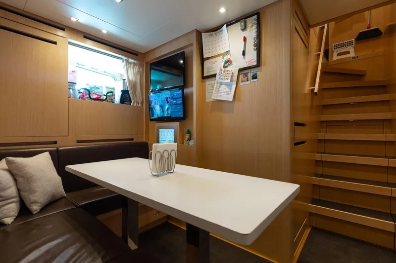 Fifty Shades Yacht Photos Pics Interior of 2018 Sanlorenzo SL106 yacht with modern dining area and staircase.