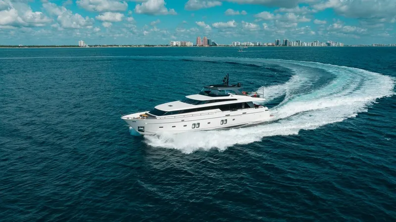 Fifty Shades Yacht Photos Pics Sanlorenzo SL106 yacht cruising on open water, 2018 model, under a clear blue sky.