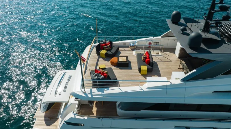 Fifty Shades Yacht Photos Pics Sanlorenzo SL106 2018 yacht with luxurious deck seating on sparkling ocean.