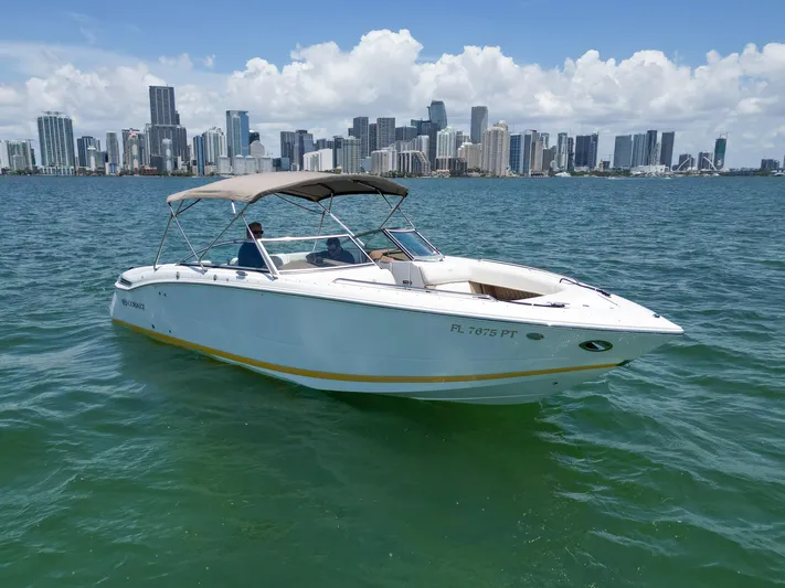  Yacht Photos Pics 2013 Cobalt 296 boat on water with city skyline in background.