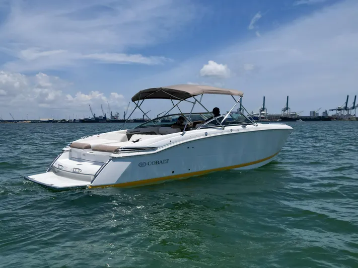  Yacht Photos Pics 2013 Cobalt 296 boat cruising on a sunny day with clear skies.