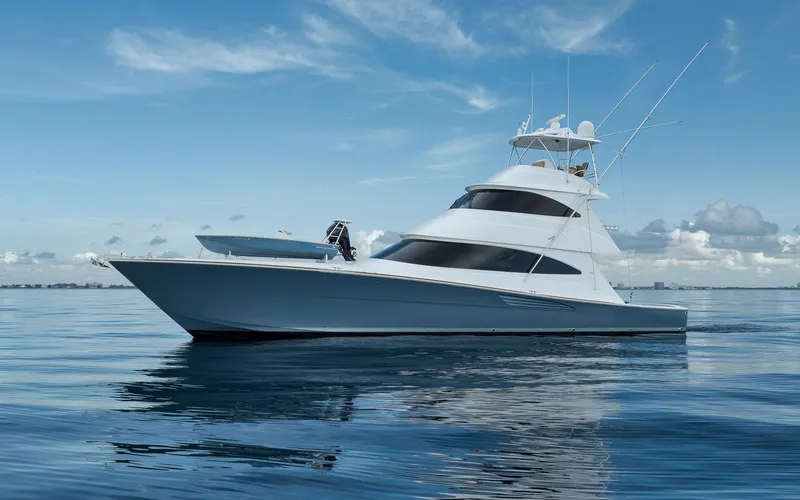 Makara Yacht Photos Pics 2018 Viking 72 Sky Bridge yacht on calm ocean under blue sky.