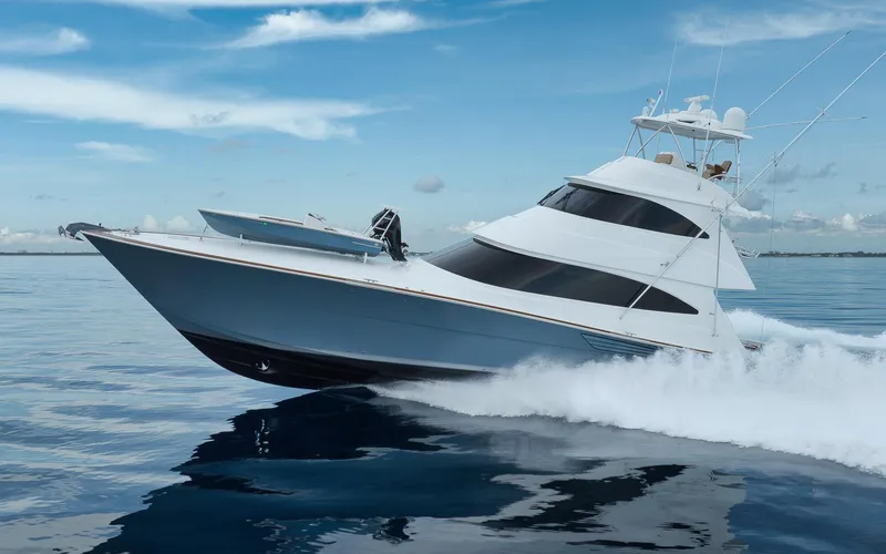 Makara Yacht Photos Pics 2018 Viking 72 Sky Bridge yacht cruising on calm ocean waters.