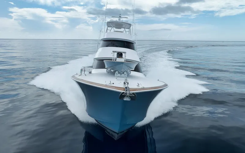 Makara Yacht Photos Pics 2018 Viking 72 Sky Bridge yacht cruising on calm ocean waters.