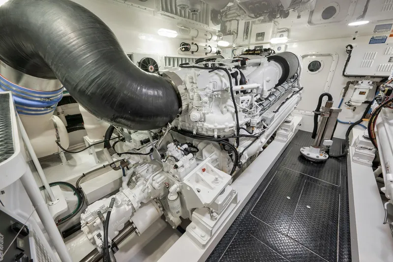 Makara Yacht Photos Pics Engine room of 2018 Viking 72 Sky Bridge yacht, showcasing powerful machinery and components.