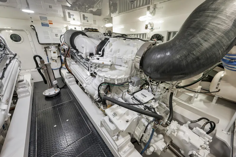 Makara Yacht Photos Pics Engine room of 2018 Viking 72 Sky Bridge yacht, showcasing powerful machinery and components.
