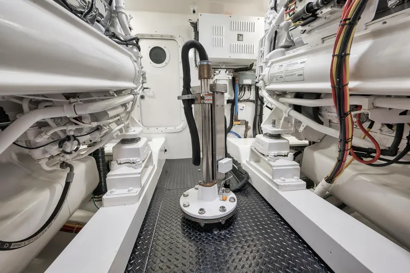 Makara Yacht Photos Pics Engine room of 2018 Viking 72 Sky Bridge yacht, showcasing machinery and components.