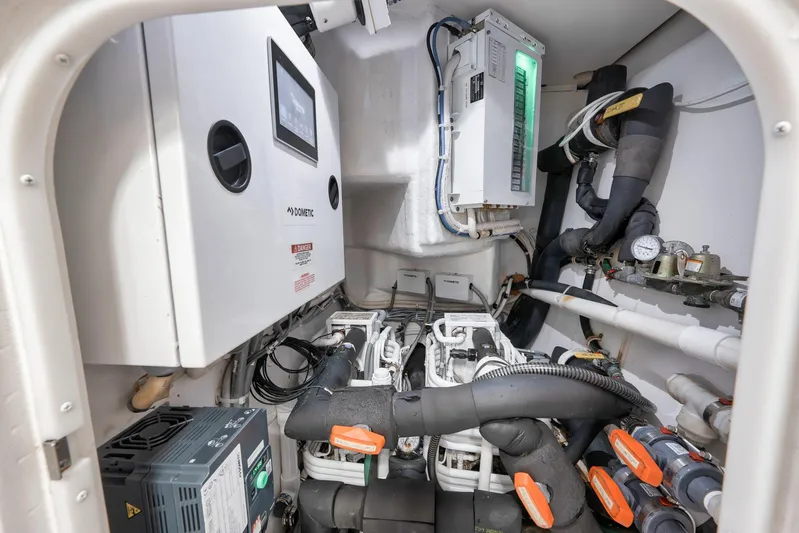 Makara Yacht Photos Pics Engine room of 2018 Viking 72 Sky Bridge yacht, featuring advanced control systems and piping.