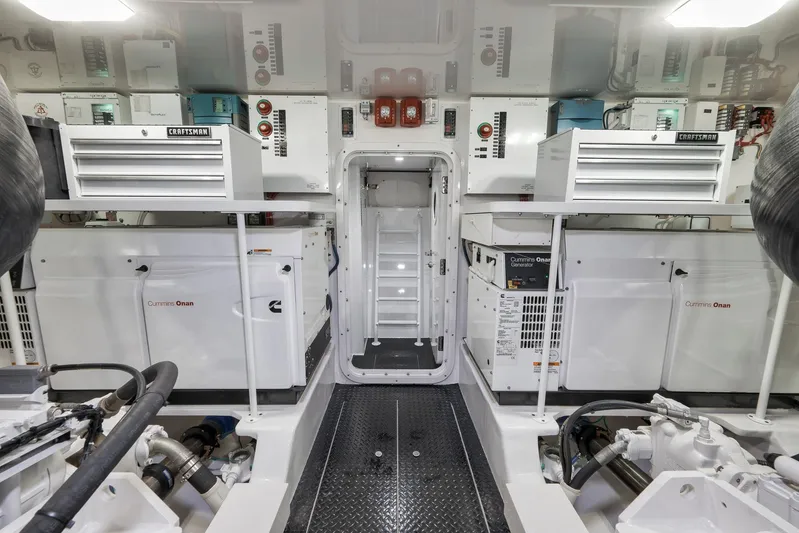 Makara Yacht Photos Pics Engine room of 2018 Viking 72 Sky Bridge yacht with Cummins Onan generators and Craftsman toolboxes.